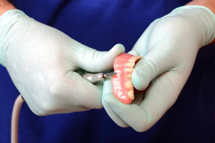 dentists hands molding gums