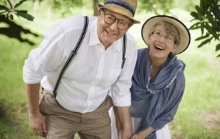 Older couple on an adventure while wearing their FOY® Dentures